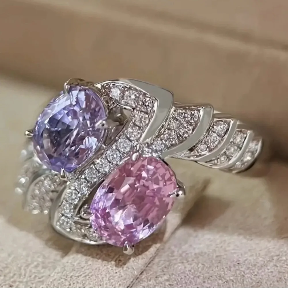 Elegant Silver Ring with Pink and Purple Gemstones.